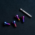 Set of four titanium M8 bolts with engraved SPEC logo for sim rigs