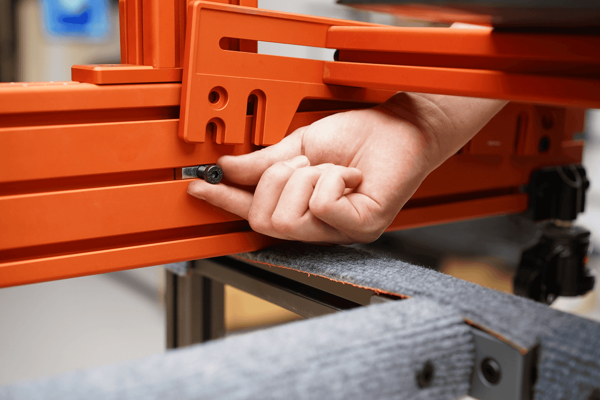 Hand fitting an M8 bolt into a 282 extrusion