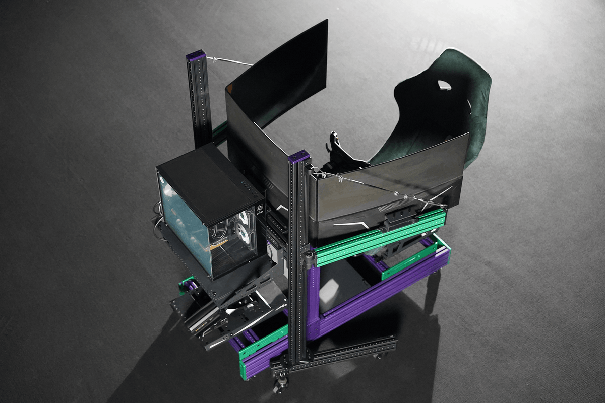 SPEC 282 sim rig, purple frame with green accent, three monitors on the SPEC Triple Monitor Stand