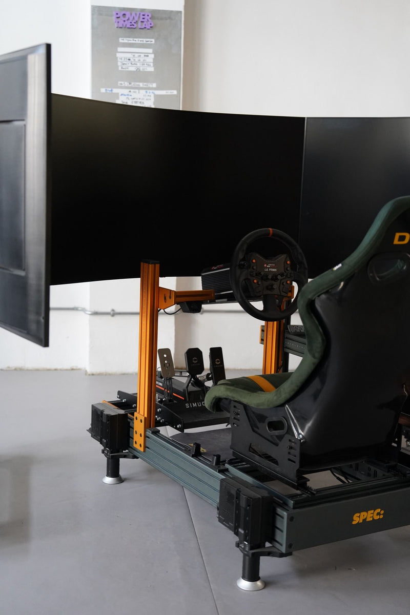 Side view of a D-BOX motion rig on a SPEC base with three curved screens around the seat