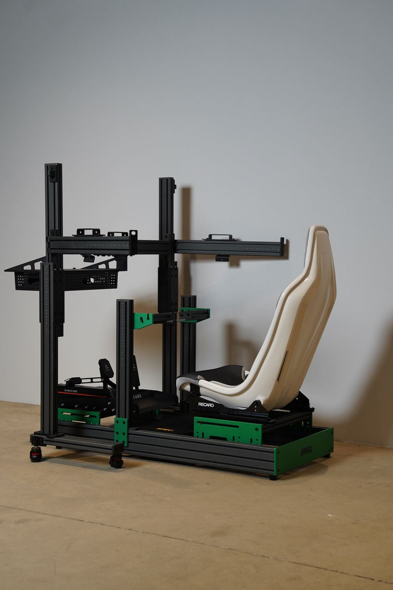 A grey and green SPEC 282 with a white seat and a triple monitor stand