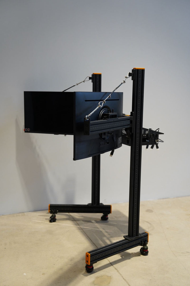A black and gold freestanding triple monitor stand with three screens, built for a client in Shanghai