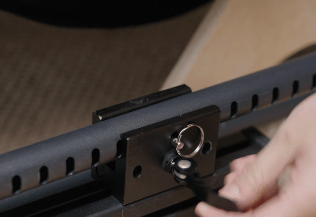 Pulling the quick-release pin on a SPEC 177 rail